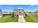 Beautifully landscaped front yard enhances this home's curb appeal at 937 Maple Stone Dr, Greenwood, IN 46143