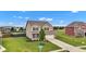 Stately two-story home with manicured lawn and mature landscaping at 937 Maple Stone Dr, Greenwood, IN 46143