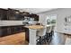 Modern kitchen featuring stainless steel appliances, granite countertops, and a breakfast bar at 937 Maple Stone Dr, Greenwood, IN 46143