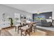 Cozy living room with a dining table, ceiling fan, and comfortable seating arrangement at 937 Maple Stone Dr, Greenwood, IN 46143