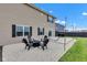 Outdoor patio area with seating and string lights creates a cozy backyard gathering spot at 937 Maple Stone Dr, Greenwood, IN 46143