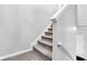 Carpeted stairway with white walls and trim, leading to the upper level of the home at 937 Maple Stone Dr, Greenwood, IN 46143