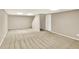 Large, unfinished basement area with neutral walls and carpet, awaiting your personal touch and design at 9650 Copley Dr, Carmel, IN 46290