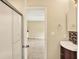 Bathroom featuring a glass door shower, updated vanity with a dark wood base and mosaic tile backsplash at 9650 Copley Dr, Carmel, IN 46290