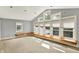 Bright bedroom featuring a wall of windows and window seat at 9650 Copley Dr, Carmel, IN 46290