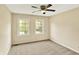 Bedroom featuring neutral carpeted flooring, a ceiling fan, and a window to let in natural light at 9650 Copley Dr, Carmel, IN 46290