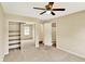 Bedroom featuring carpeted flooring, mirrored closet, and open doorway into additional rooms at 9650 Copley Dr, Carmel, IN 46290