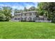 Charming two-story home with black shutters and a lush green lawn at 9650 Copley Dr, Carmel, IN 46290