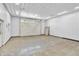 Large garage interior featuring concrete floors and metal walls, providing functional storage and workspace at 9650 Copley Dr, Carmel, IN 46290