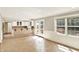 Bright kitchen with tiled floor, white cabinetry, and outdoor access through French doors at 9650 Copley Dr, Carmel, IN 46290