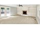 Living room boasts built-in bookshelves, a fireplace, and french doors leading to the deck at 9650 Copley Dr, Carmel, IN 46290