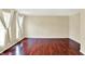 Spacious living room features hardwood floors, soft lighting, and ample natural light at 9650 Copley Dr, Carmel, IN 46290