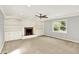 Spacious living room with built-in bookshelves, a fireplace, and a large window at 9650 Copley Dr, Carmel, IN 46290