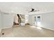 Inviting living room features carpeted floors, recessed lighting, and access to the backyard through glass doors at 9650 Copley Dr, Carmel, IN 46290