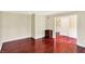 Well-lit living room features beautiful hardwood floors and neutral wall color at 9650 Copley Dr, Carmel, IN 46290
