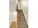 Carpeted staircase leading to the upper level, enhancing the home's accessibility and design at 9650 Copley Dr, Carmel, IN 46290