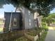 Exterior of home featuring a fenced yard and raised garden beds filled with plants at 1002 N New Jersey St, Indianapolis, IN 46202