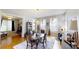 Stylish dining room with hardwood floors, modern lighting, and view into living room at 1002 N New Jersey St, Indianapolis, IN 46202