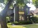 Charming two-story home with blue siding, a well-kept lawn, and mature trees in a residential neighborhood at 1002 N New Jersey St, Indianapolis, IN 46202