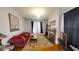 Bright living room featuring hardwood floors, a decorative rug, fireplace, and comfortable seating at 1002 N New Jersey St, Indianapolis, IN 46202