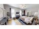 Spacious main bedroom with hardwood floors, and a view of the windows, closet and furniture at 1002 N New Jersey St, Indianapolis, IN 46202