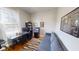 Bright and airy office features hardwood floors, a desk, and a comfortable couch at 1002 N New Jersey St, Indianapolis, IN 46202