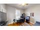 Cozy office space with hardwood floors, a desk, aquarium, and a comfortable couch at 1002 N New Jersey St, Indianapolis, IN 46202