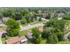An aerial view showcasing a tranquil neighborhood, with lush trees, tidy lawns, and close to roadways at 1020 N Ritter Ave, Indianapolis, IN 46219
