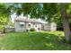 Spacious backyard featuring a lush green lawn and detached garage at 1020 N Ritter Ave, Indianapolis, IN 46219