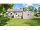 The backyard offers a peaceful outdoor retreat with a lush lawn, perfect for outdoor activities and relaxation at 1020 N Ritter Ave, Indianapolis, IN 46219