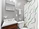 Full bathroom with vanity, decorative shower curtain, towel rack, and neutral gray walls at 1020 N Ritter Ave, Indianapolis, IN 46219