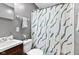Bathroom featuring a vanity, toilet, decorative shower curtain, and gray walls at 1020 N Ritter Ave, Indianapolis, IN 46219