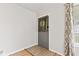 Simple entryway featuring neutral tones and a practical tile accent at the door at 1020 N Ritter Ave, Indianapolis, IN 46219
