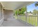 Covered porch with stone accents and a white railing, perfect for enjoying the outdoors at 1020 N Ritter Ave, Indianapolis, IN 46219