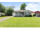 Charming single-story home with a well-manicured lawn and a quaint front porch at 1020 N Ritter Ave, Indianapolis, IN 46219