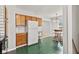 Bright and efficient kitchen with classic cabinets, ample storage, and an adjacent dining area at 1020 N Ritter Ave, Indianapolis, IN 46219