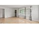 Bright living room features hardwood floors, large windows, and neutral paint, creating a welcoming atmosphere at 1020 N Ritter Ave, Indianapolis, IN 46219