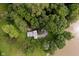 An aerial view highlights this home's lush, green surroundings and its serene waterfront setting at 1065 E 76Th St, Indianapolis, IN 46240