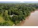 Aerial view of a serene property with lush greenery and river access, ideal for nature lovers at 1065 E 76Th St, Indianapolis, IN 46240