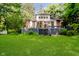 Charming home featuring a spacious backyard and a deck, perfect for outdoor entertaining and relaxation at 1065 E 76Th St, Indianapolis, IN 46240