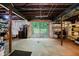 Unfinished basement with exposed ceiling, concrete flooring, and glass sliding doors to the backyard at 1065 E 76Th St, Indianapolis, IN 46240