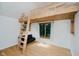 Bedroom featuring unique loft bed design with ladder, window, and futon underneath at 1065 E 76Th St, Indianapolis, IN 46240