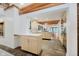 The kitchen features custom cabinetry, stone floors, stainless steel appliances, and an open concept design at 1065 E 76Th St, Indianapolis, IN 46240