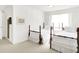 Bedroom features two beds with carpet floors, neutral paint, and a bright window at 10712 Cardinal Cir, Indianapolis, IN 46231
