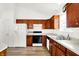Bright kitchen featuring wood cabinets, ample counter space, and modern appliances at 10712 Cardinal Cir, Indianapolis, IN 46231
