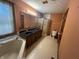 This bathroom features a double sink, a large mirror, a shower, and a soaking tub at 1082 E County Road 400 S, Clayton, IN 46118