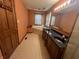This bathroom features a double sink, a large mirror, a shower, and a soaking tub at 1082 E County Road 400 S, Clayton, IN 46118