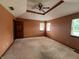 This bedroom features neutral walls and carpet, with two windows to allow natural light and a ceiling fan at 1082 E County Road 400 S, Clayton, IN 46118
