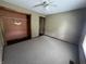 This bedroom features neutral walls and carpet, with a closet and a window to allow natural light at 1082 E County Road 400 S, Clayton, IN 46118