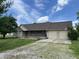 Charming single-story brick home with a covered front porch and an attached two-car garage at 1082 E County Road 400 S, Clayton, IN 46118